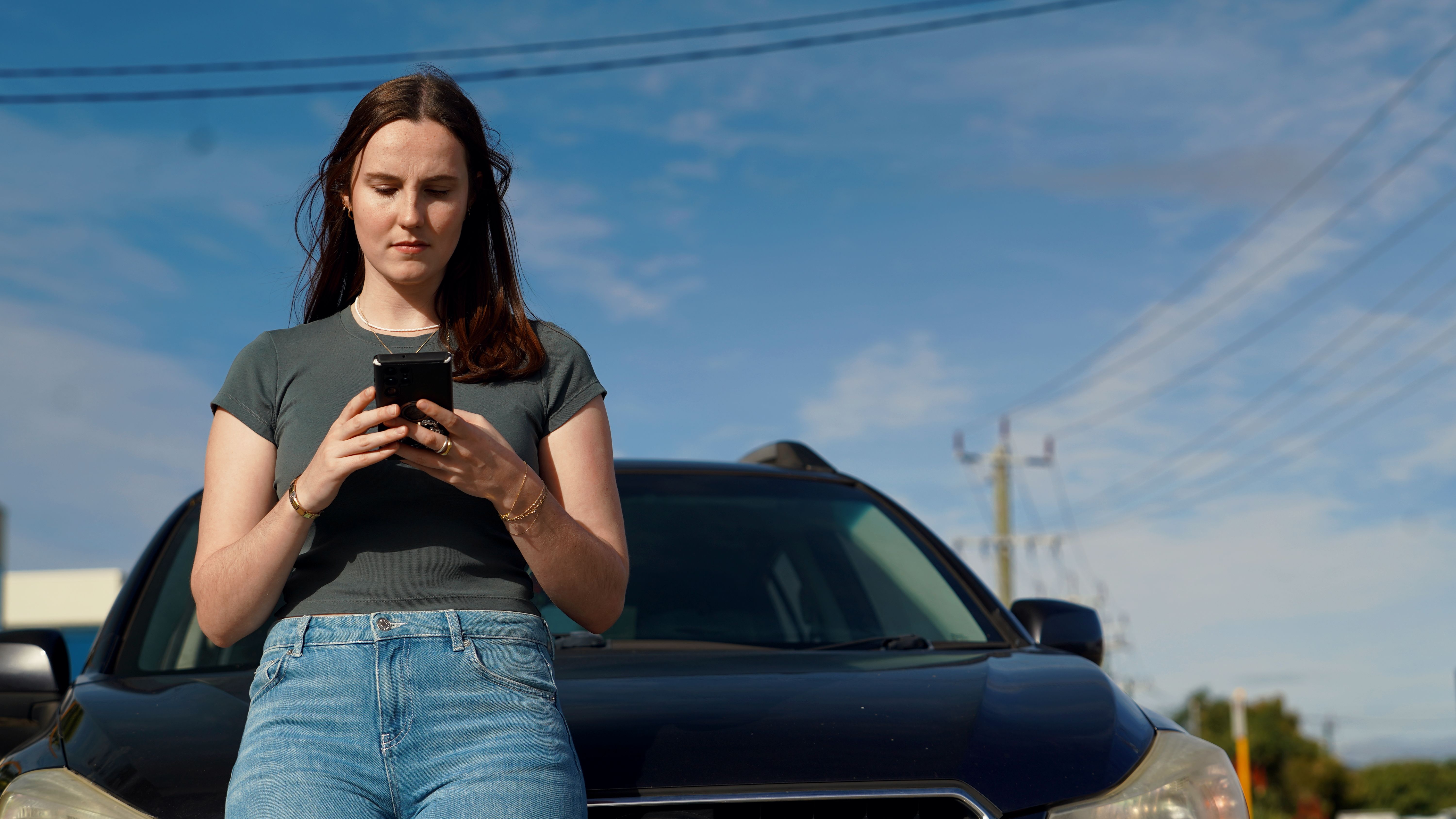Hand holding a phone to make a call